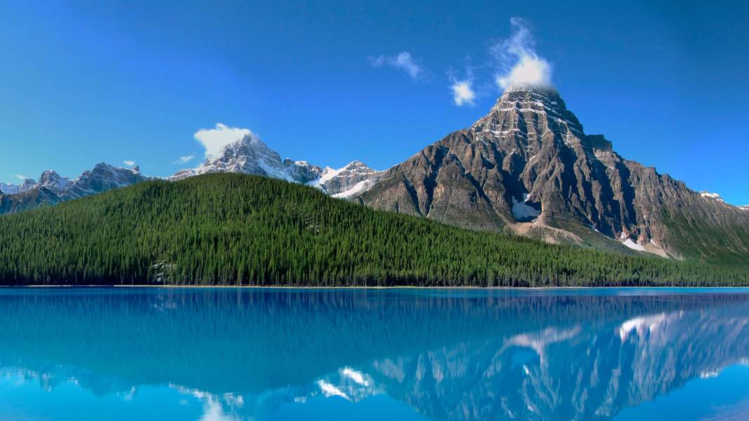 a lake with a mountain in the background