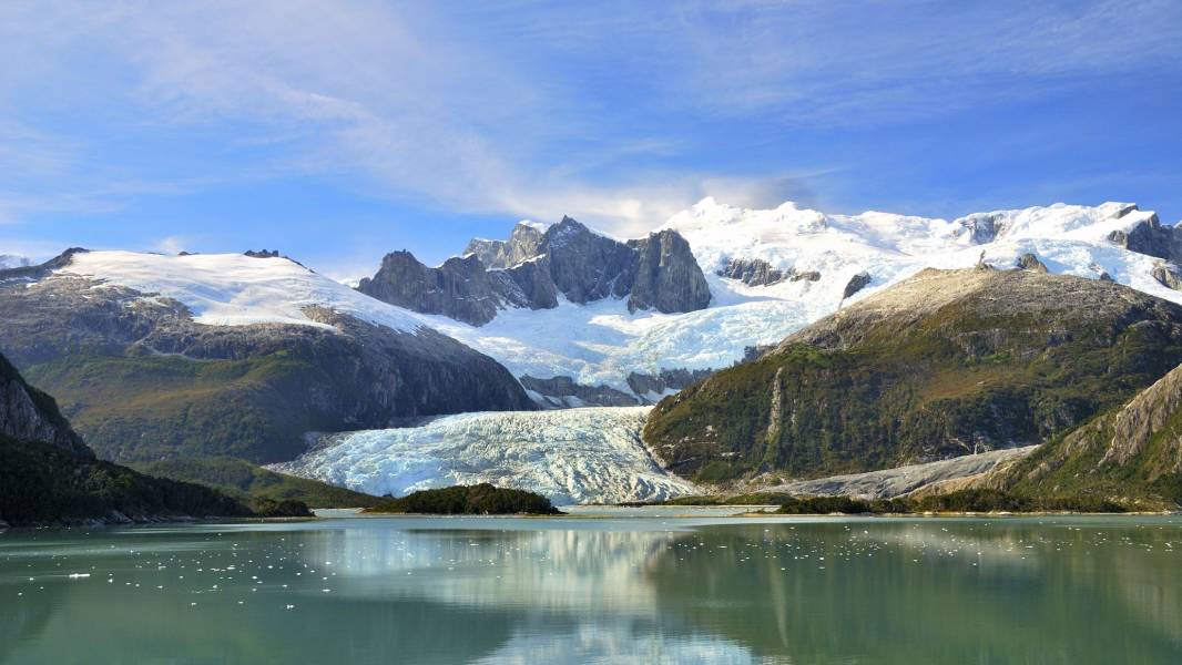 a lake with a mountain in the background