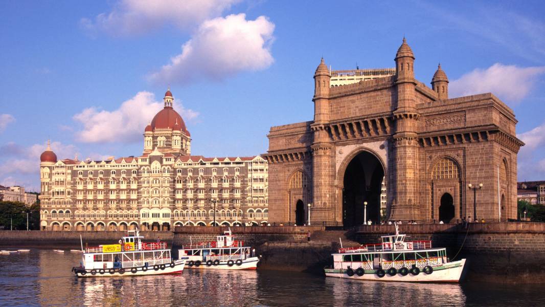 a boat on the water in front of a building