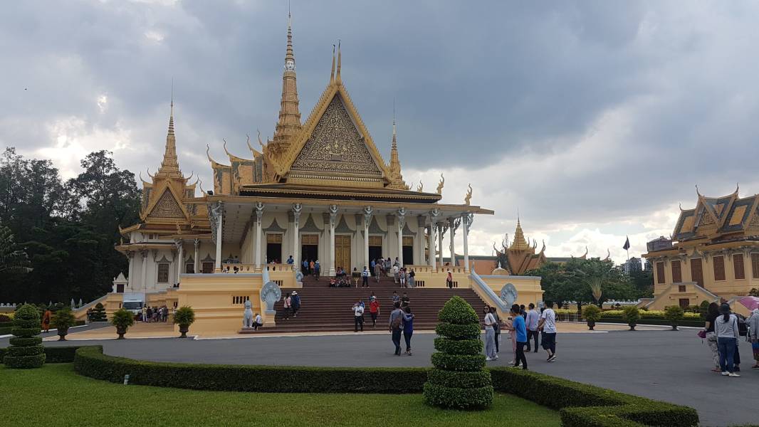 a statue in front of Royal Palace, Phnom Penh