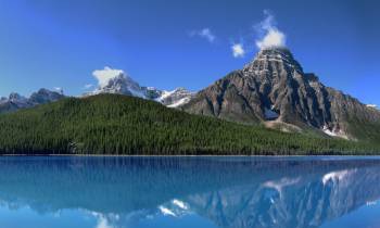 a lake with a mountain in the background