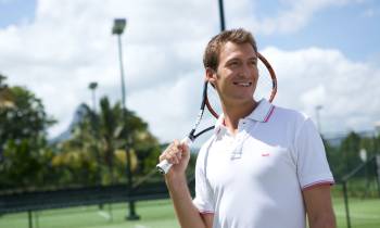 a man holding a racket