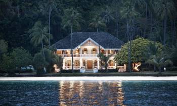 a house next to a body of water
