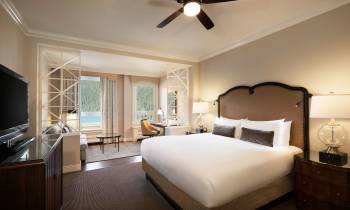 a bedroom with a large bed in a room
