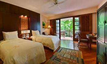 a bedroom with a large bed in a hotel room