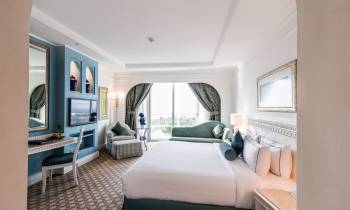 a bedroom with a bed in a room