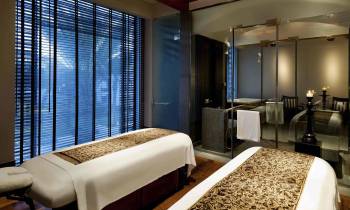 a bedroom with a large bed in a hotel room