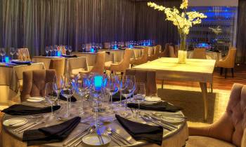 a table filled with wine glasses