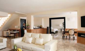 a living room filled with furniture and a flat screen tv