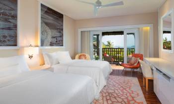 a bedroom with a large bed in a hotel room