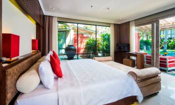 a bedroom with a large bed in a room