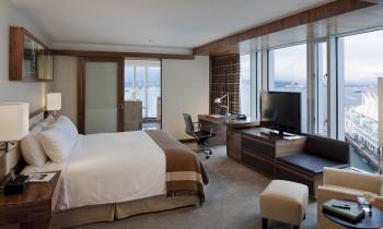 a bedroom with a large bed in a hotel room