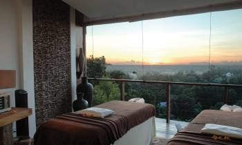 a bedroom with a large bed in a room