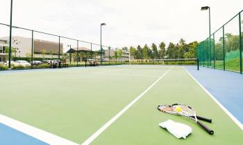 a person on a court with a racket