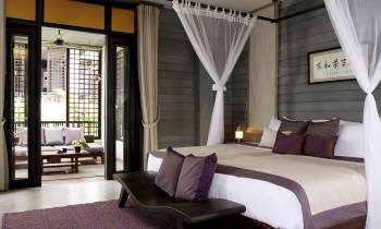 a bedroom with a large bed in a hotel room