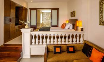 a bedroom with a large mirror