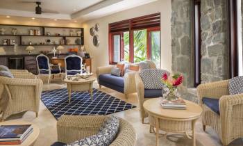 a living room filled with furniture and a fire place