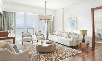 a living room filled with furniture and a large window