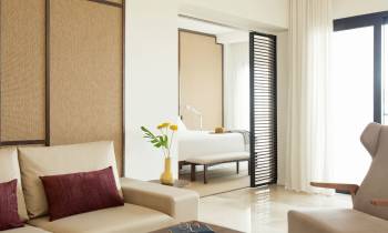a living room filled with furniture and a large window
