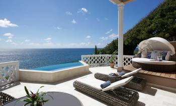 a chair sitting in front of a pool of water