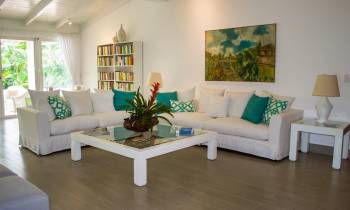 a living room filled with furniture and a large window