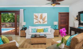 a living room filled with furniture and a large window