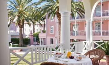 a dining table in front of a building