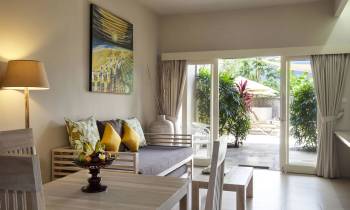 a living room filled with furniture and a large window