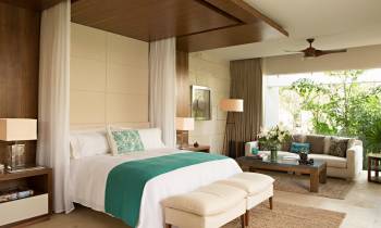 a bedroom with a large bed in a hotel room