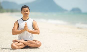 a man standing on top of a sandy beach