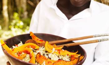 a person holding a plate of food