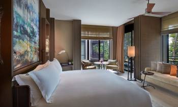 a bedroom with a large bed in a hotel room