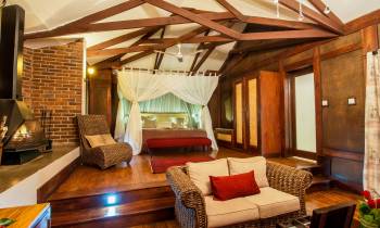 a room filled with furniture and a fireplace