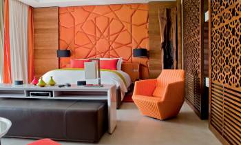 a large red chair in a room