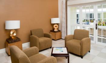 a living room filled with furniture and a large window