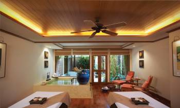 a living room filled with furniture and a large window