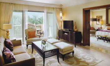 a living room filled with furniture and a large window