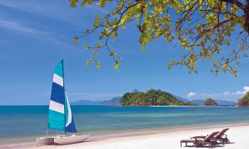 a boat sitting on top of a beach