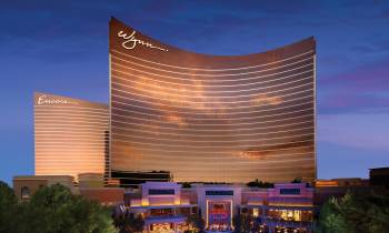 a large building in the background with Wynn Las Vegas in the background