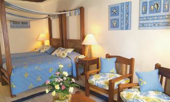 a bedroom with a bed in a room