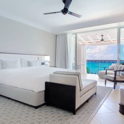 a bedroom with a bed and desk in a room