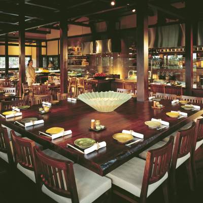 a group of people sitting at a table in a restaurant