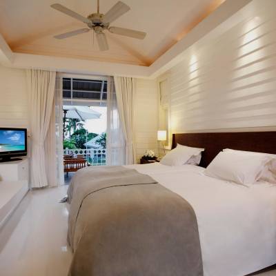 a bedroom with a large bed in a hotel room