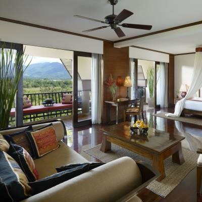 a living room filled with furniture and a large window