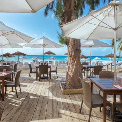 a dining room table with a blue umbrella