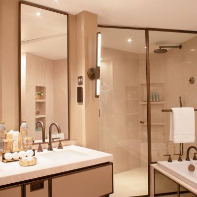 a double sink and large mirror