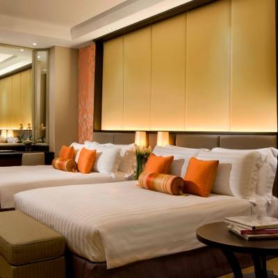 a bedroom with a large bed in a hotel room