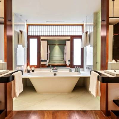 a room with a sink and a mirror