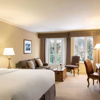 a bedroom with a large bed in a hotel room