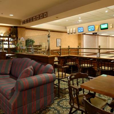 a living room filled with furniture and a table in a restaurant